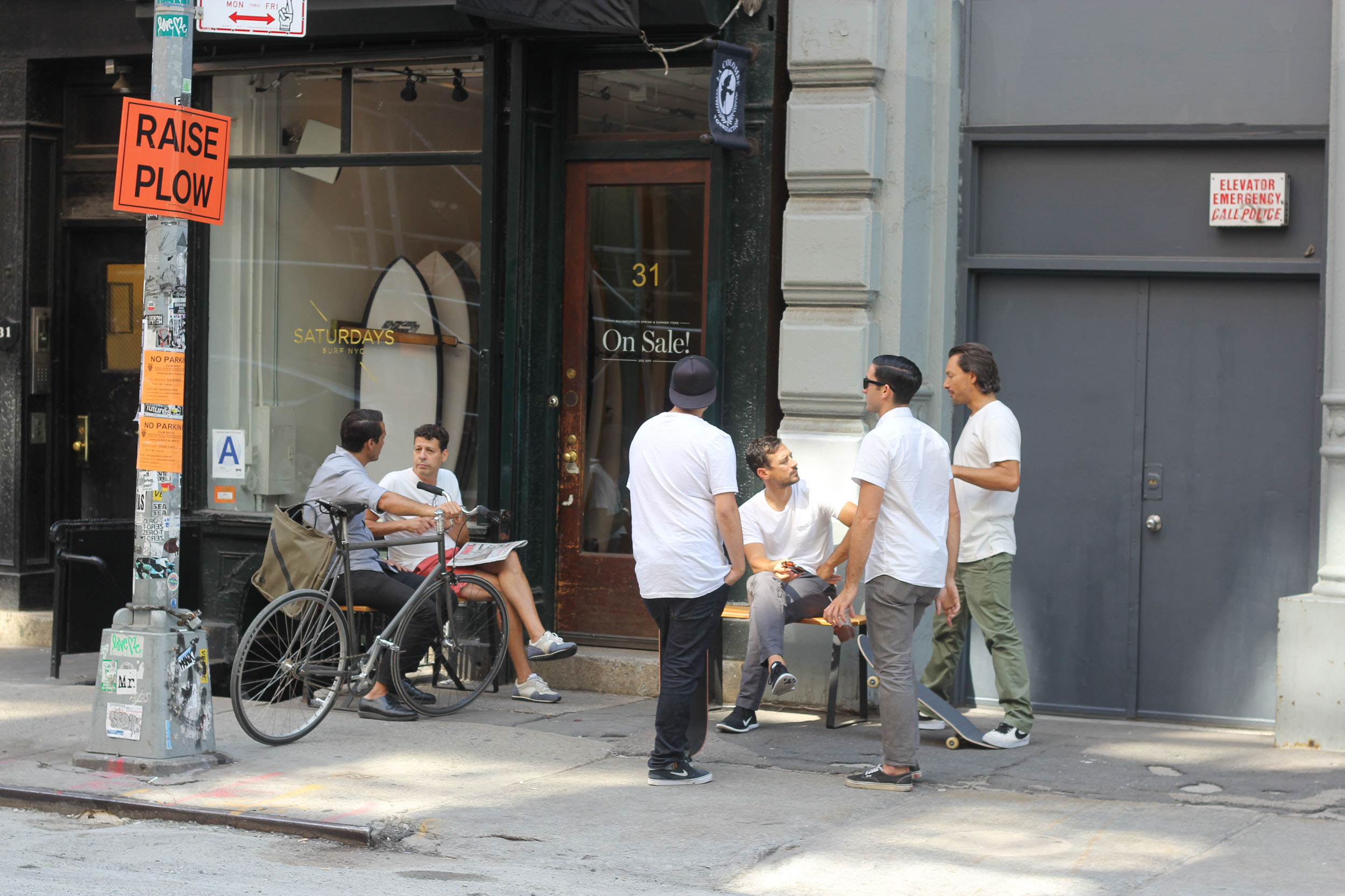 Men outside Saturdays NYC Soho