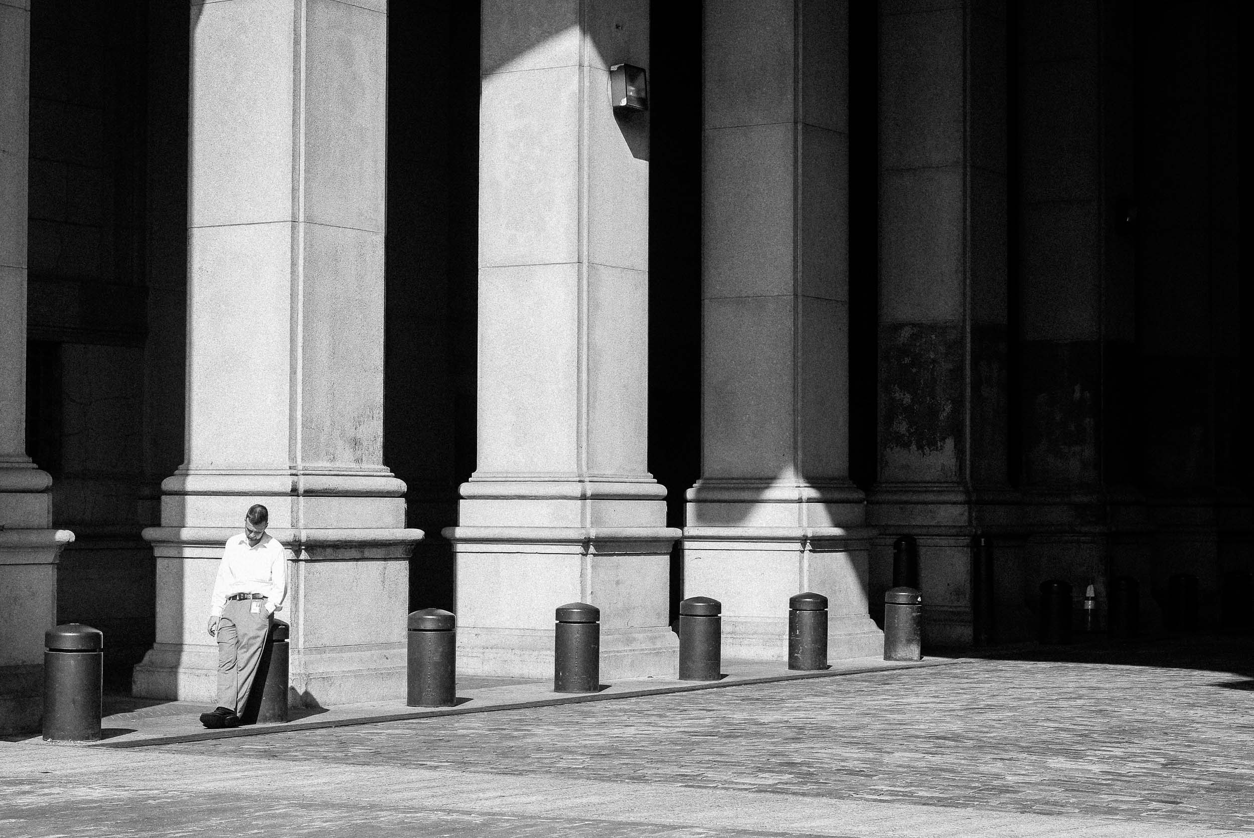 Man taking a smoking break near City Hall New York, NY